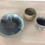 Three stoneware empty pockets with blue drips