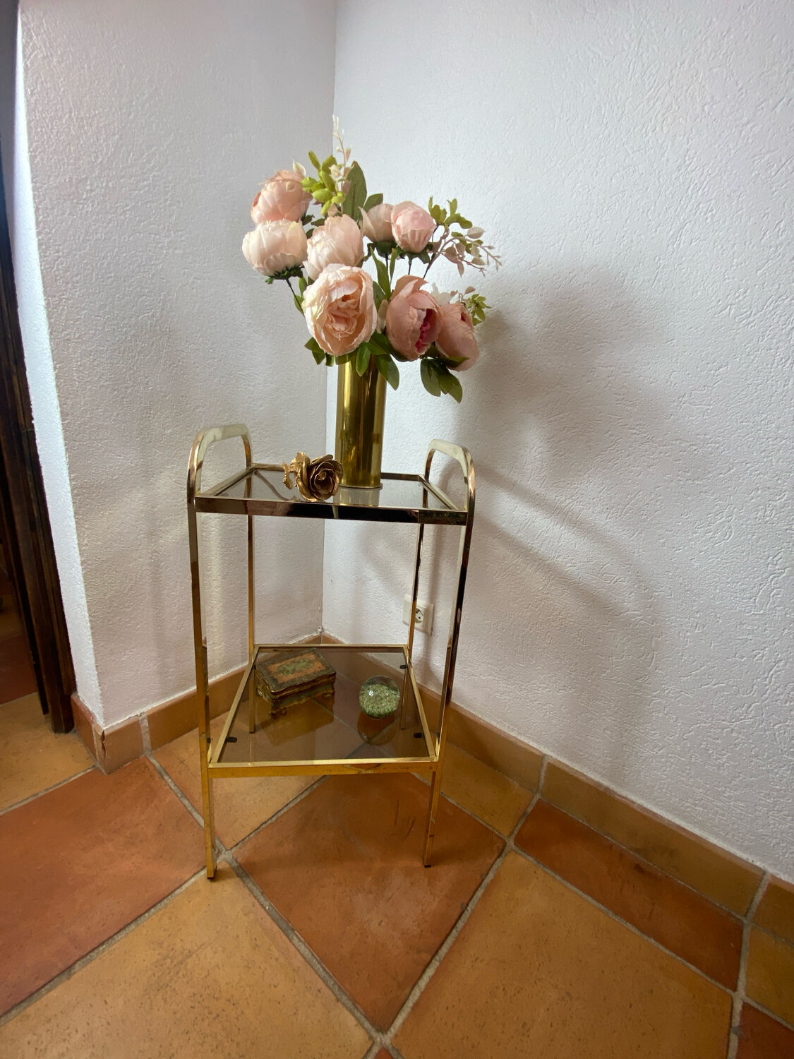 Gold metal and smoked glass console table.