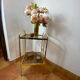Gold metal and smoked glass console table.