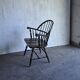 Brown wooden Windsor chair, 19th century — slatted backrest and carved seat