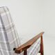 Vintage armchair and beige blue tartan footrest modern design