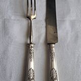 Couvert à gigot en métal argenté.