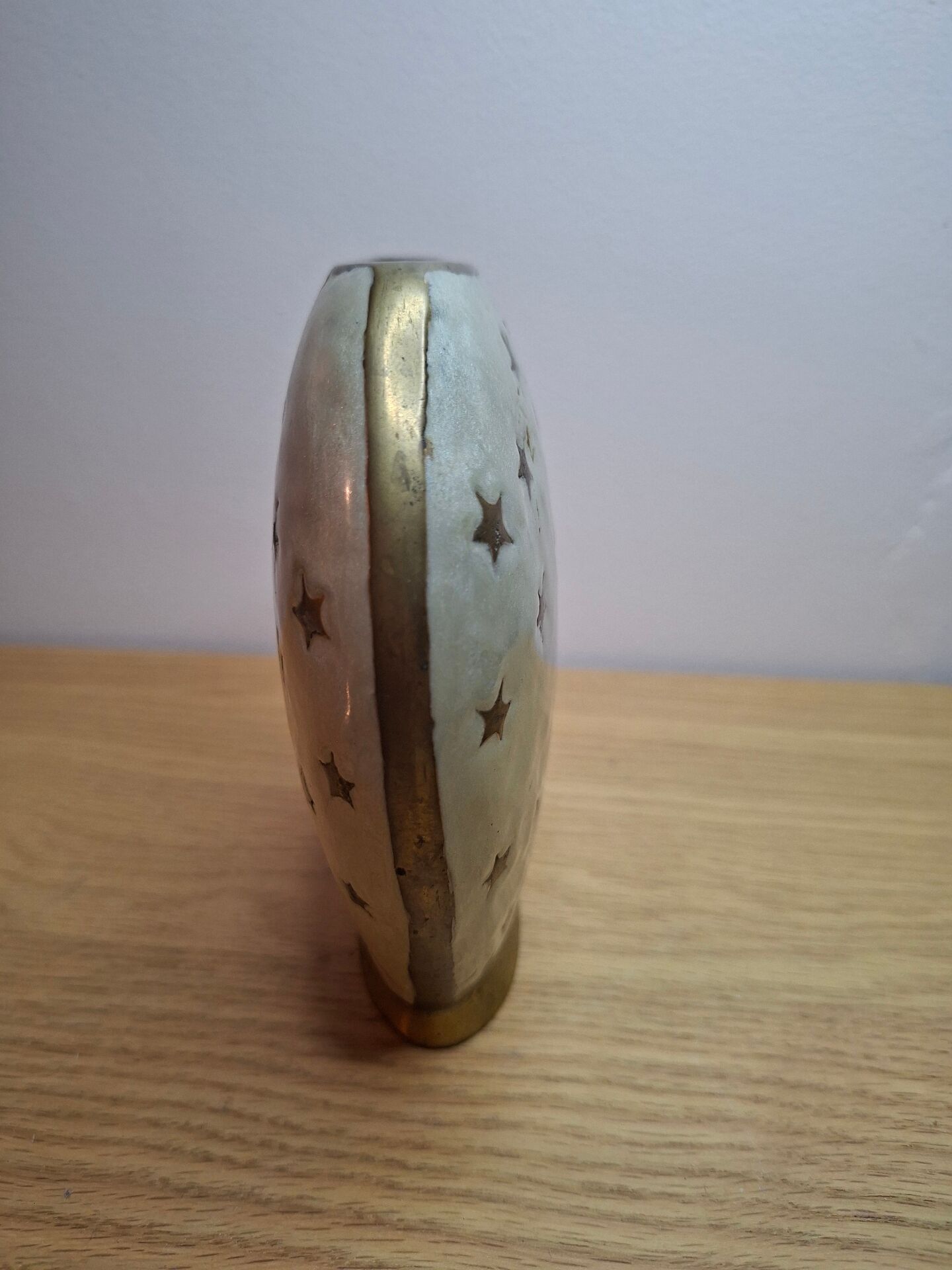 Small vintage soliflore vase in white enamelled brass with golden stars.