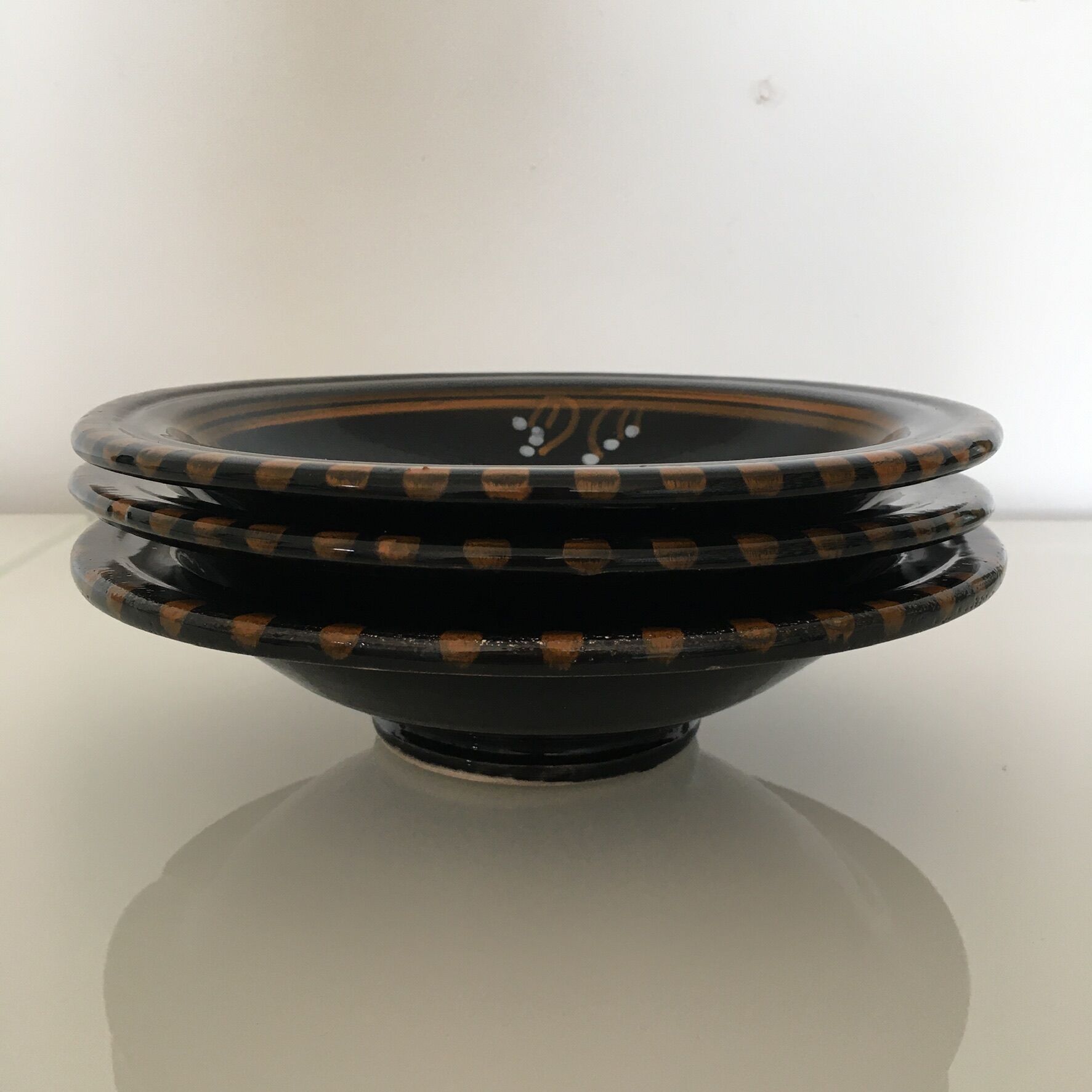 Set of 3 black decorative deep plates.