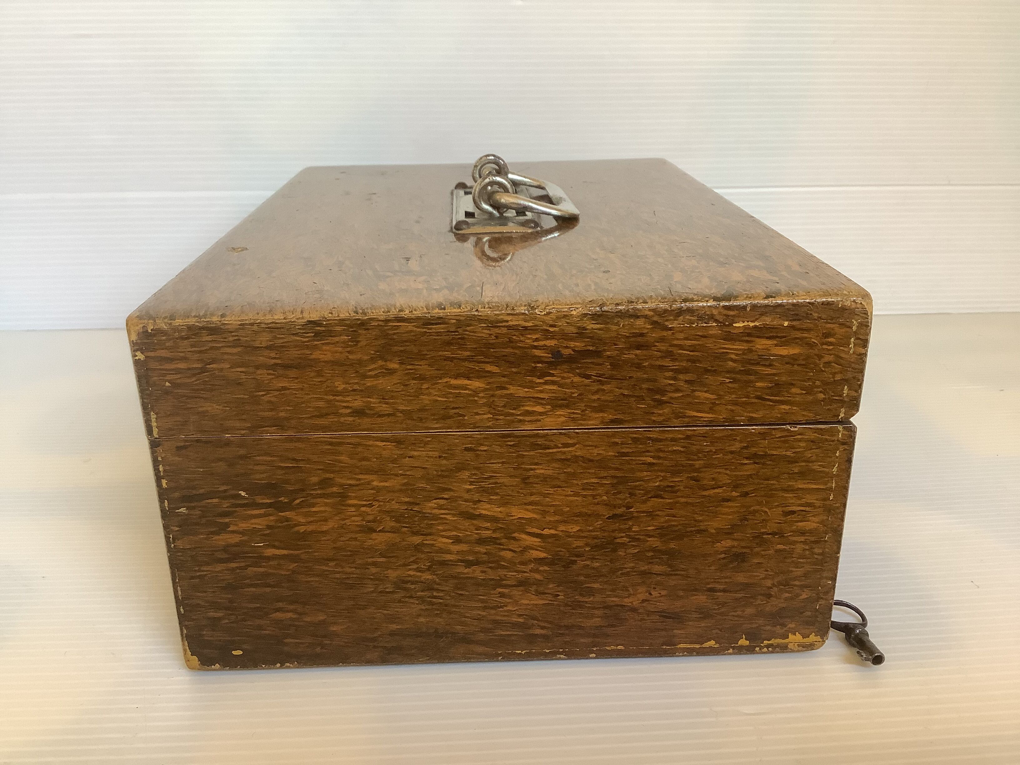 Old wooden box with handle and metal keys