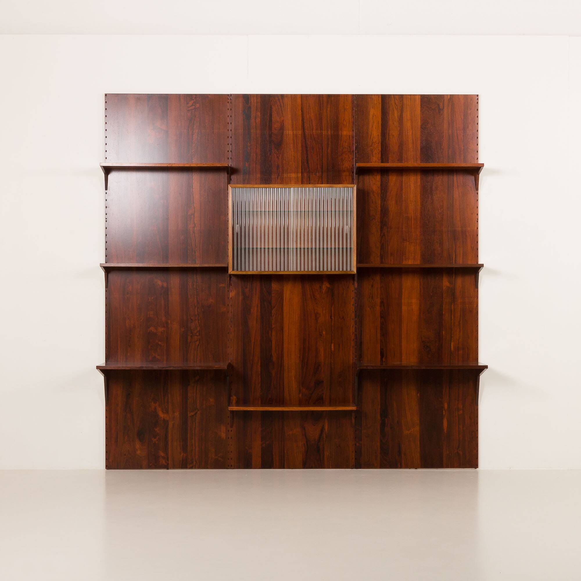 Poul Cadovius rosewood wall unit on panels for Cado, Denmark 1960s