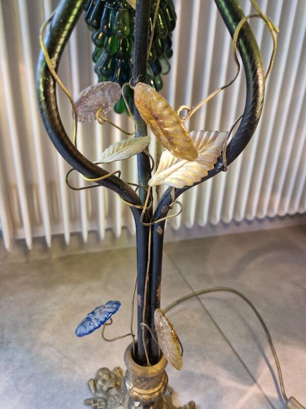 Bronze table lamp and Murano glass grape clusters.