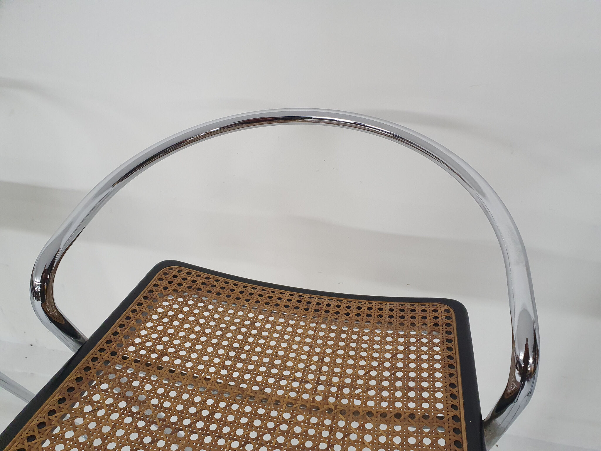 Set of four chrome and cane bar stools, 1970's