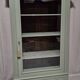 Glass display cabinet with drawer