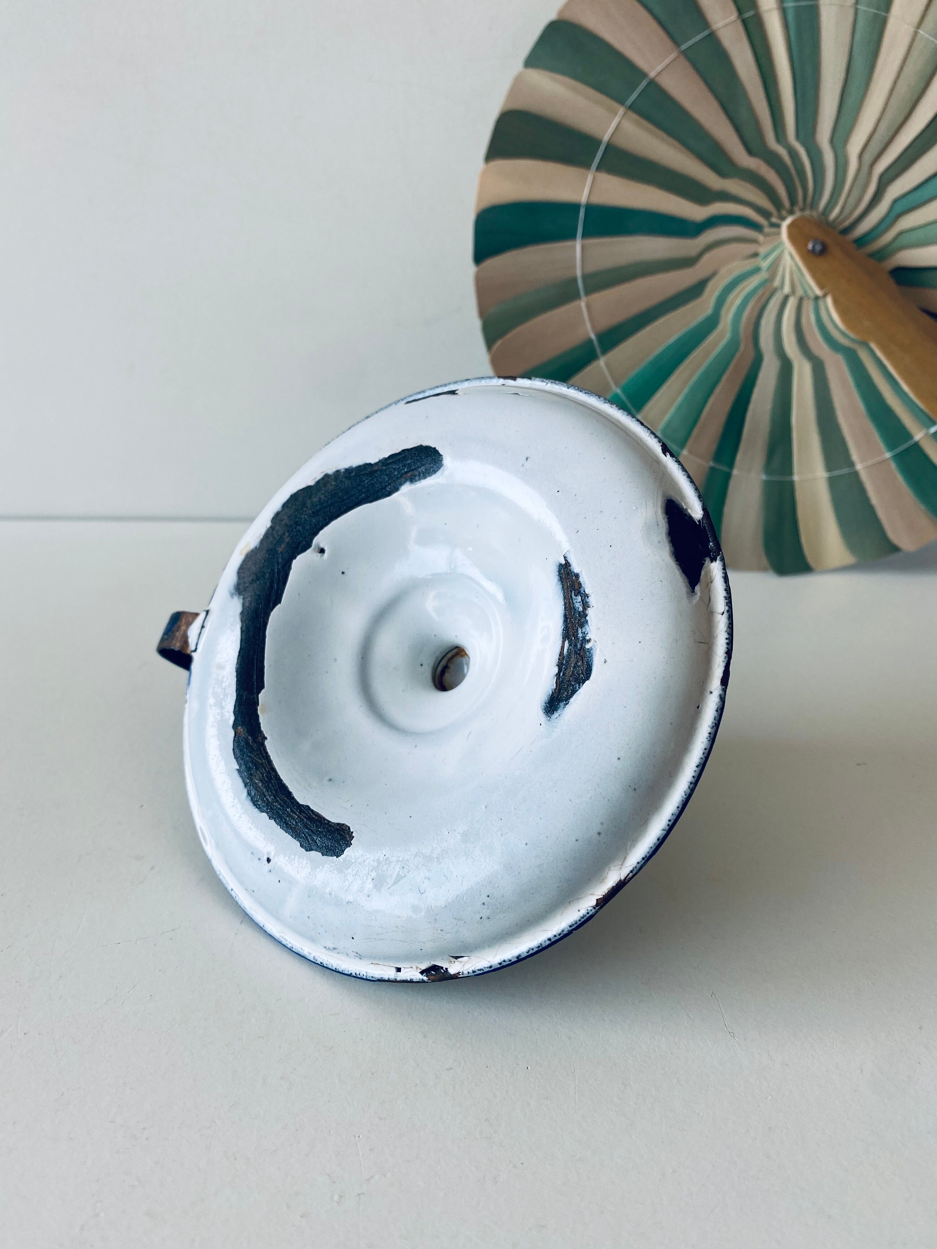 Antique candle holder in white and blue enamelled metal