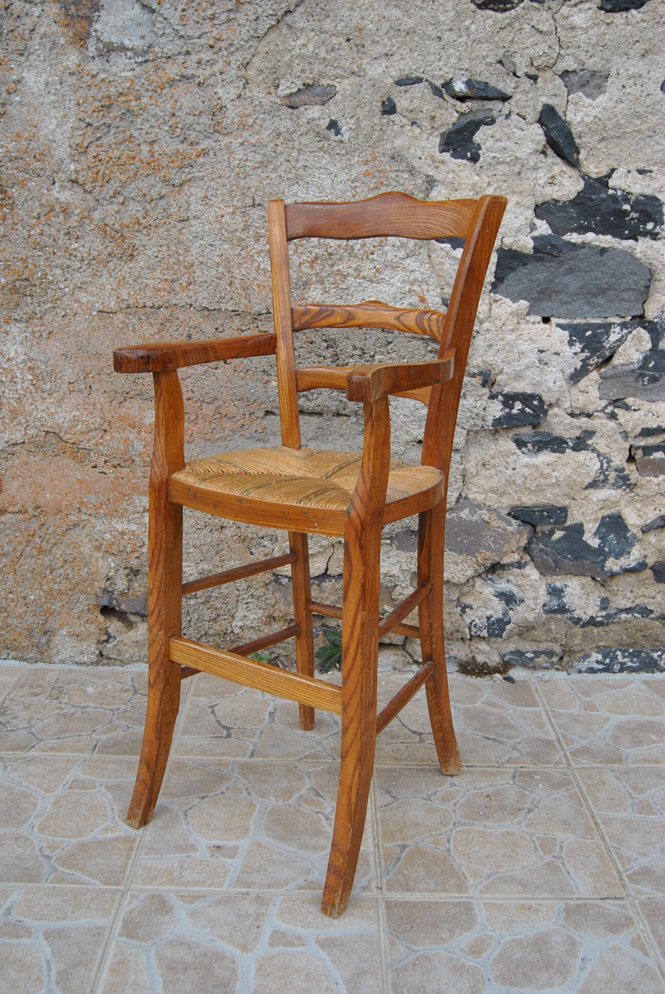 Wooden children's high chair and mulched seat