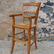 Wooden children's high chair and mulched seat
