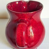 Vintage red enamel ceramic pitcher