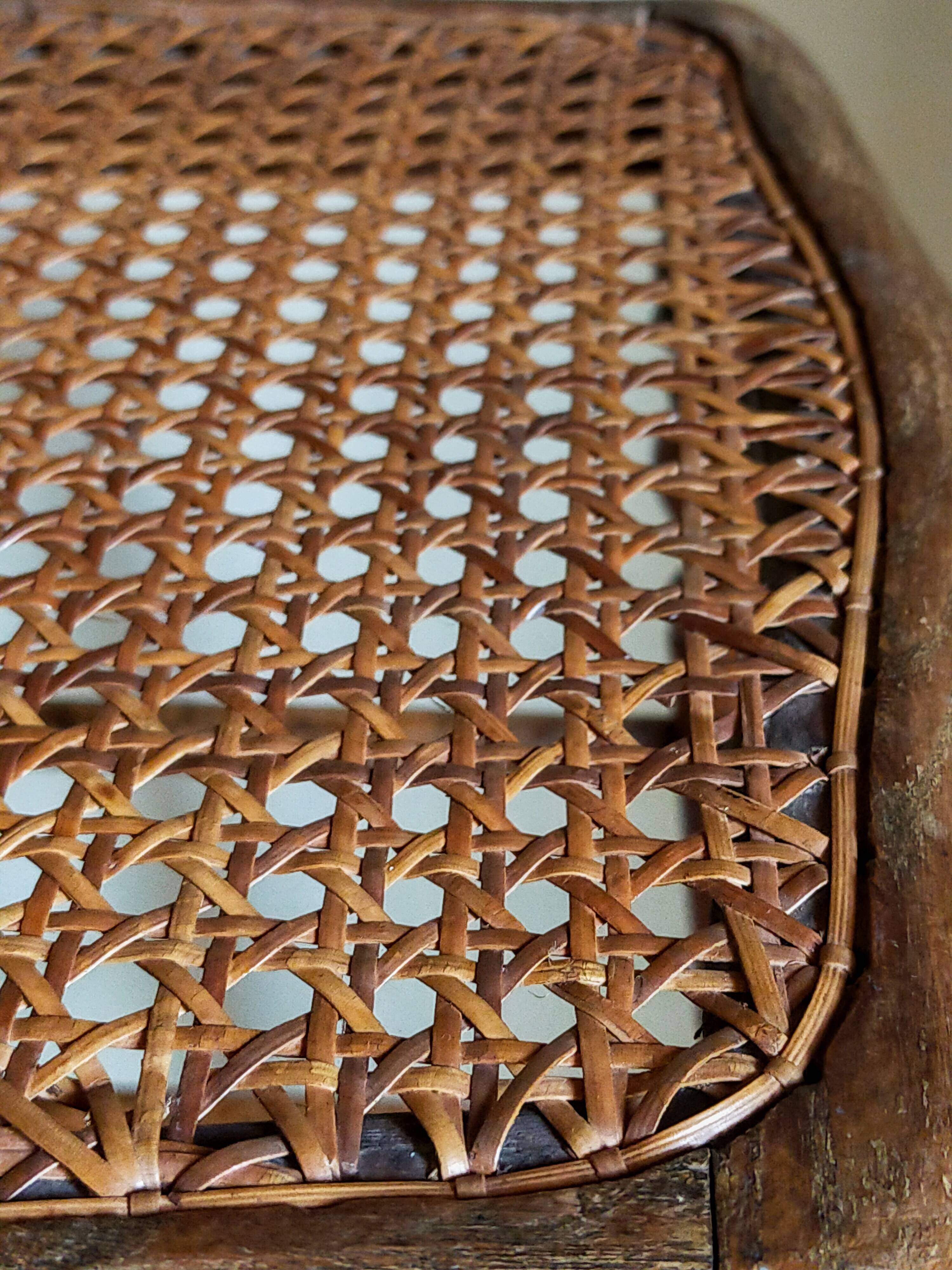 Antique stool with cane and turned wood