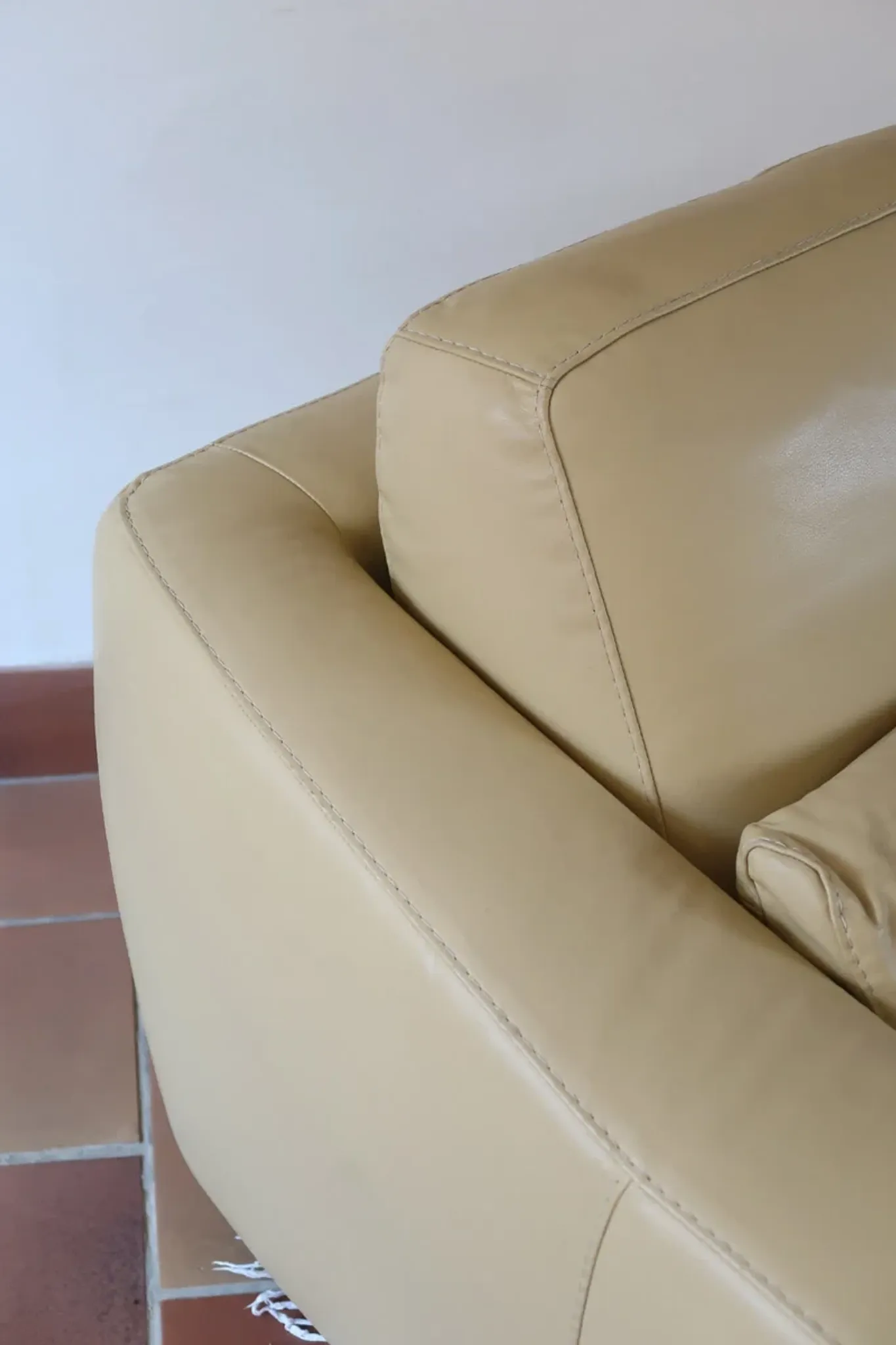 Vintage club armchair in butter yellow faux leather from the 1980s.