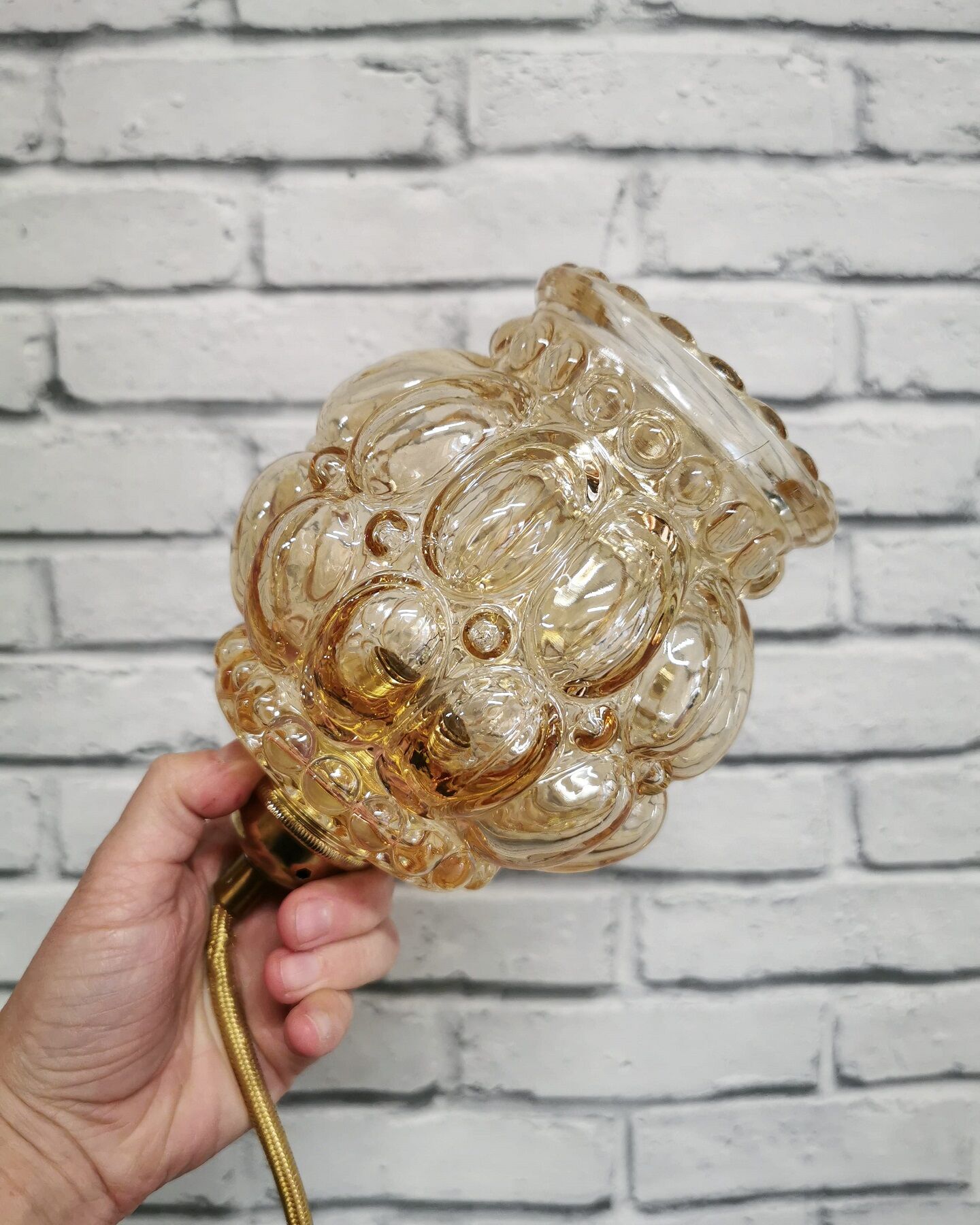 Old vintage hanging lamp stroller in moulded glass