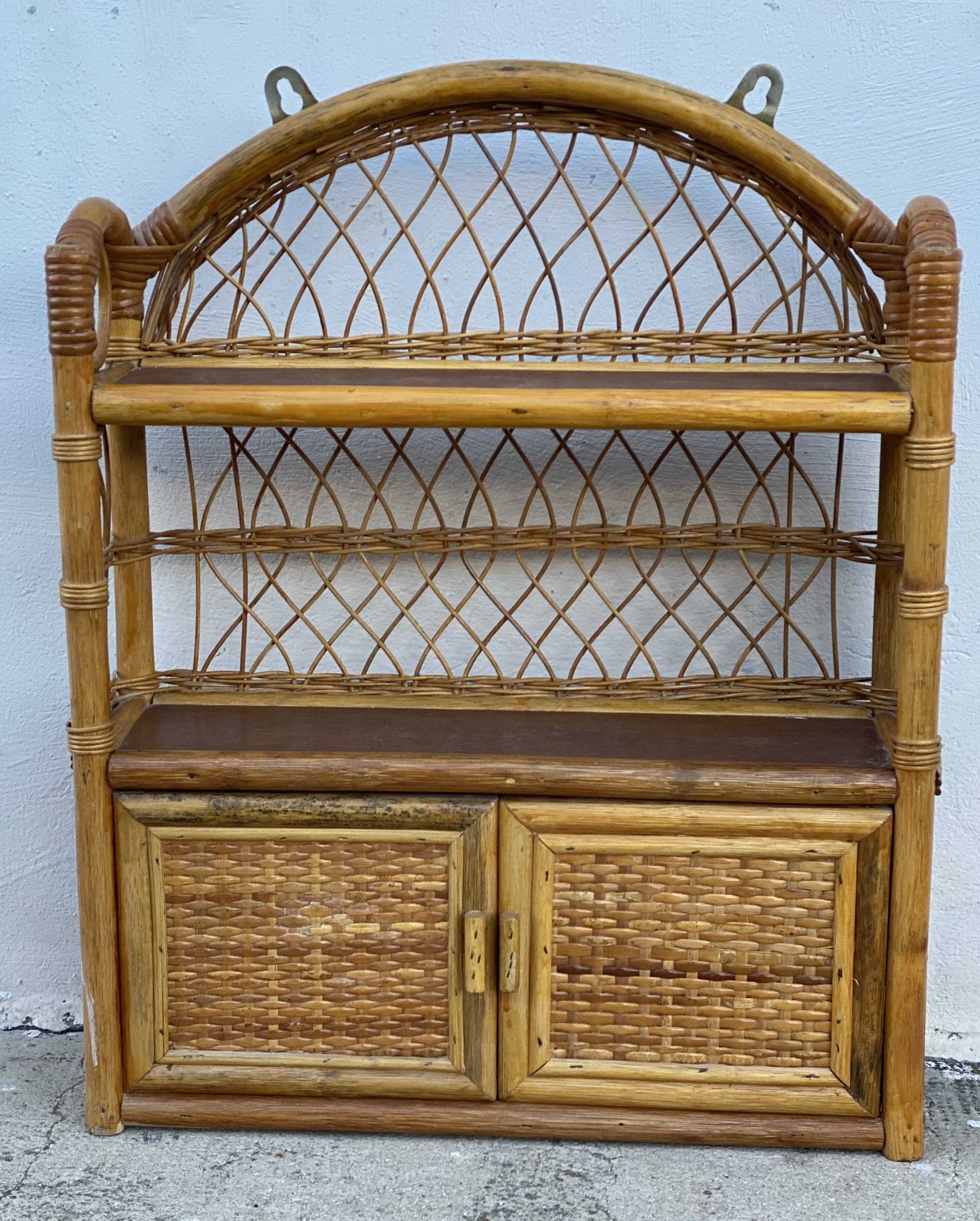 Small vintage 1970s rattan wall shelf with 2 doors.