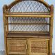 Small vintage 1970s rattan wall shelf with 2 doors.