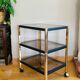 Side table in gold metal and smoked glasses 1970s