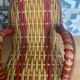 Antique miniature rocking chair in rattan for dolls.