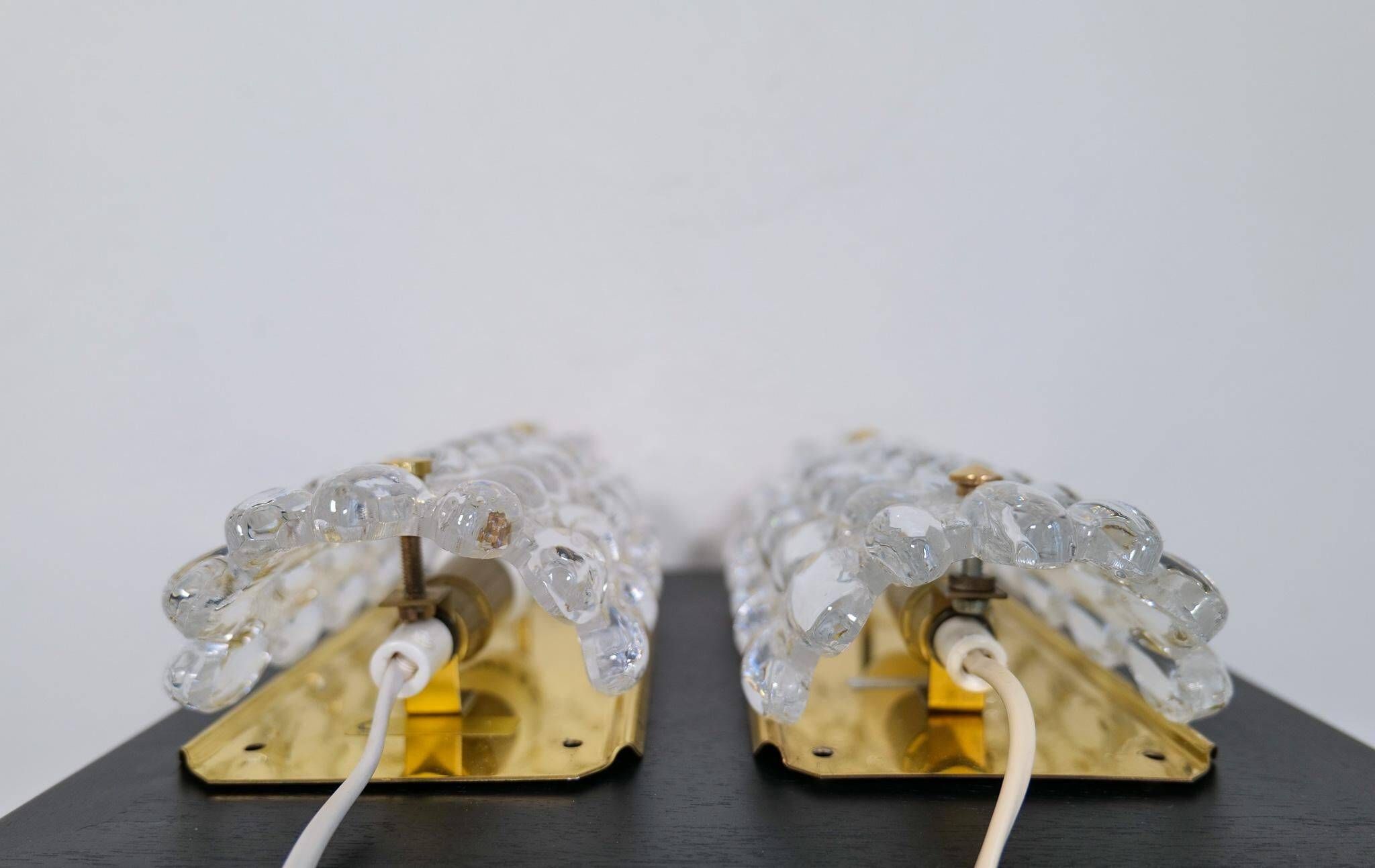 Modern mid-century crystal wall sconces in the shape of a drop by Orrefors by Carl Fagerlund.
