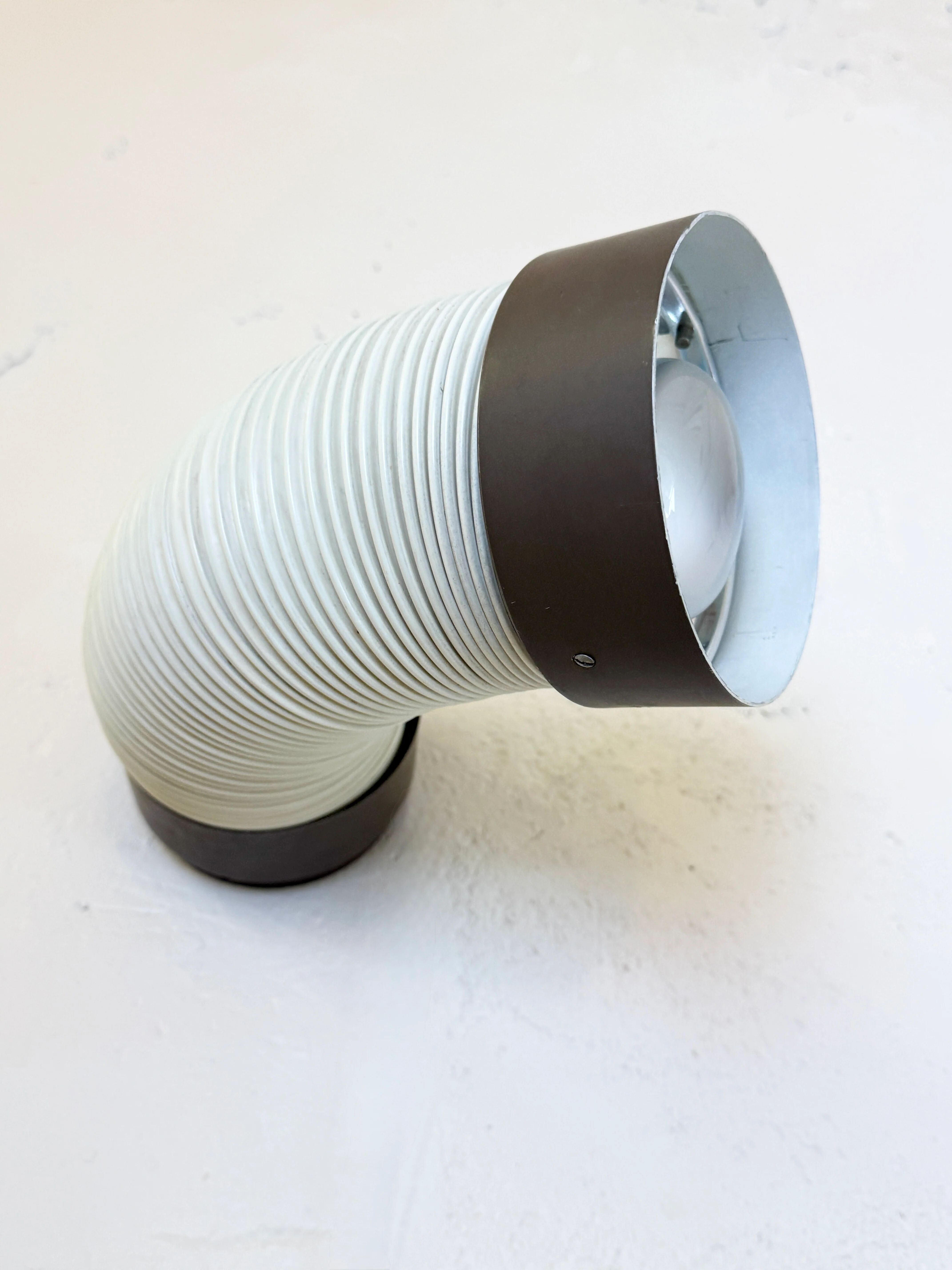 Pair of adjustable wall lights "Tuyau" by Raak, 1970s