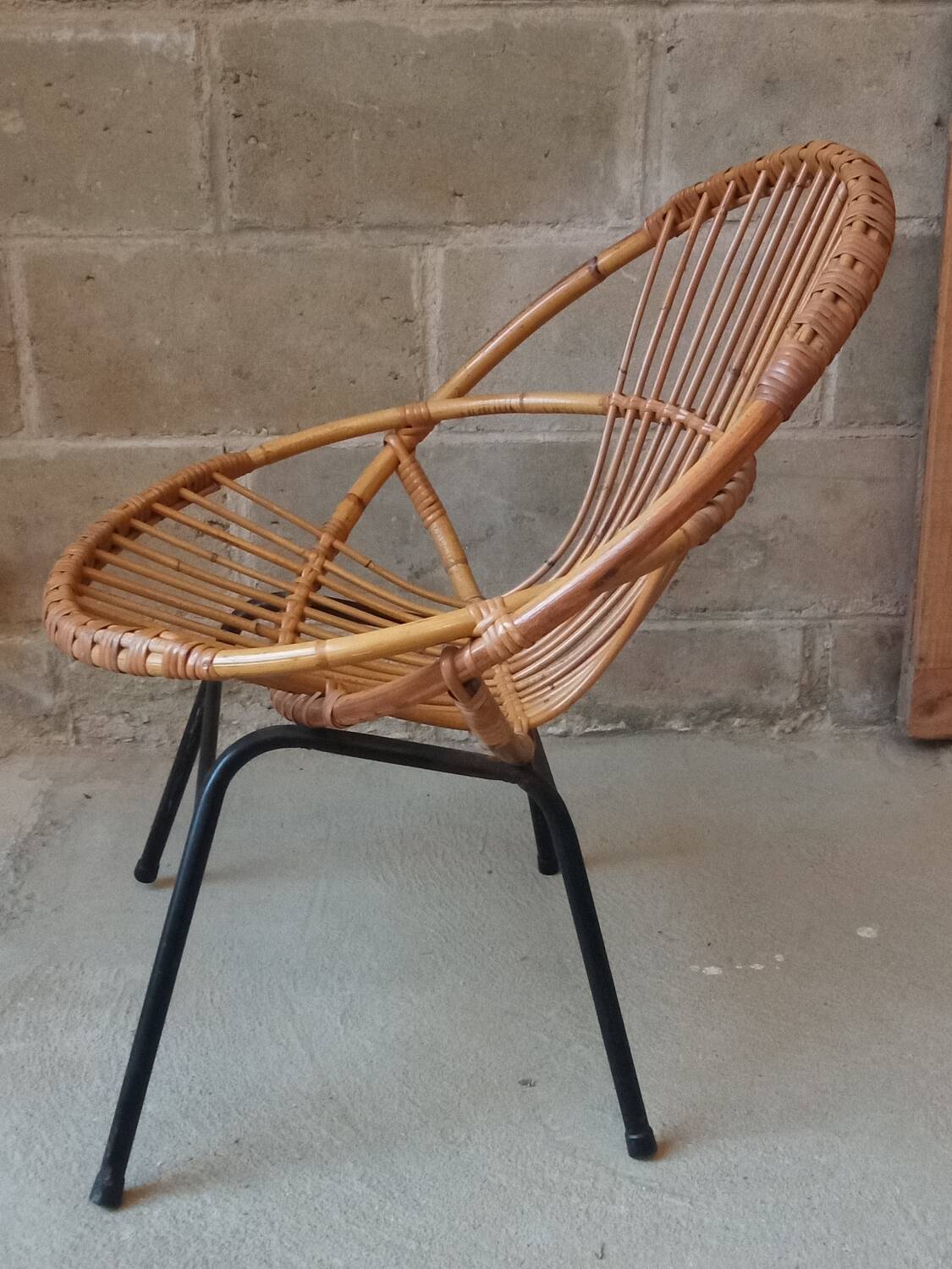 Rattan armchair with metal base from the 1950s