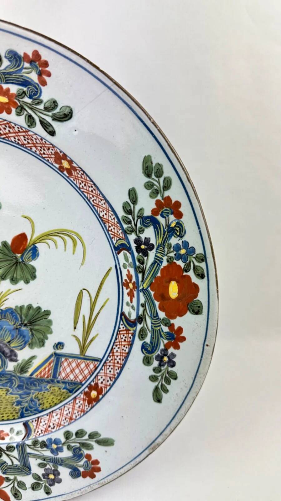 Delftware plate with gilded highlights, relief decoration, 18th century, 35 cm