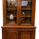 English showcase in two mahogany bodies and 19th century veneer