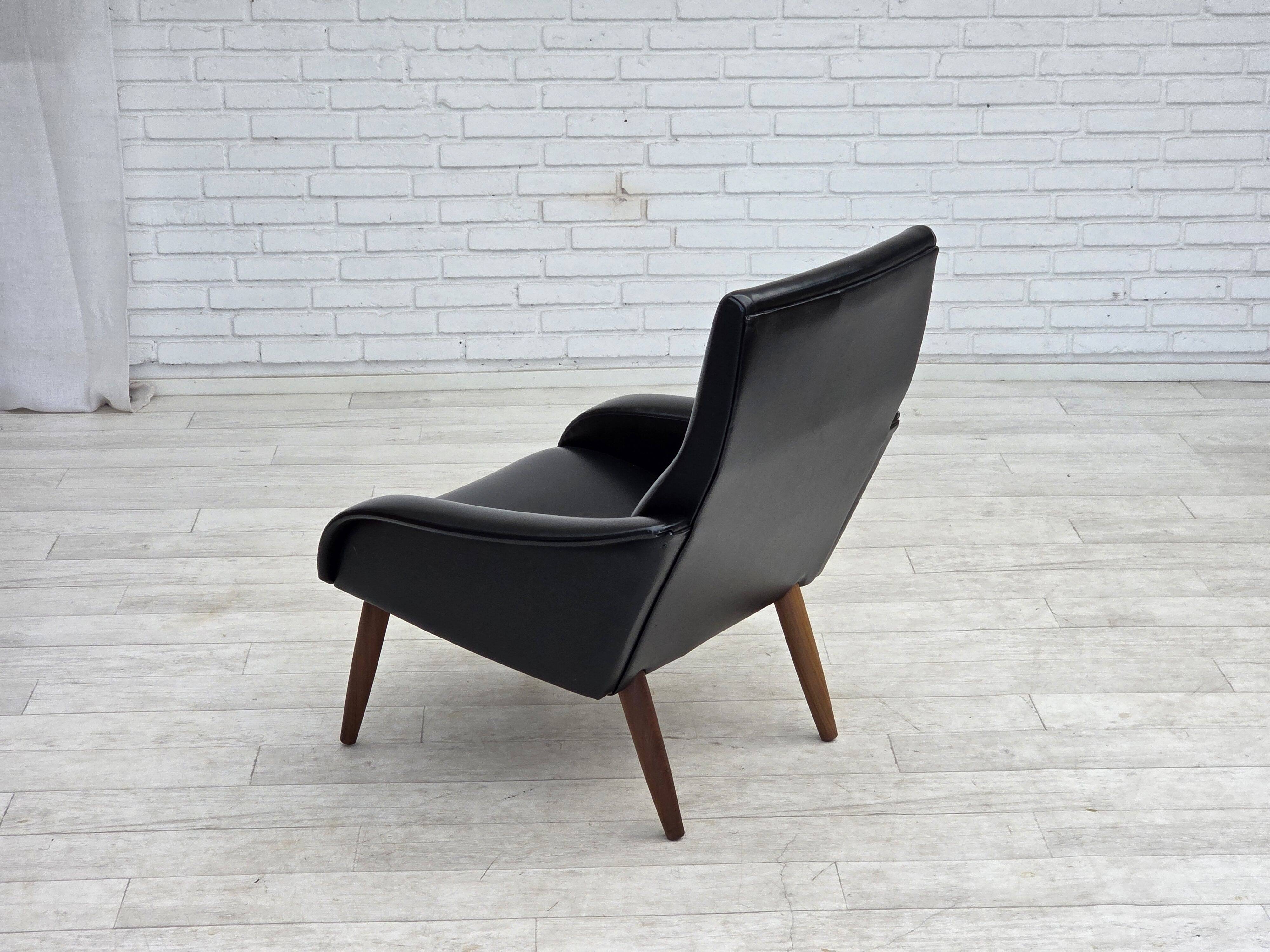 1970s, Danish armchair, black artificial leather, teak wood legs.