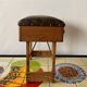 Old foldable fisherman's stool in wood and leather