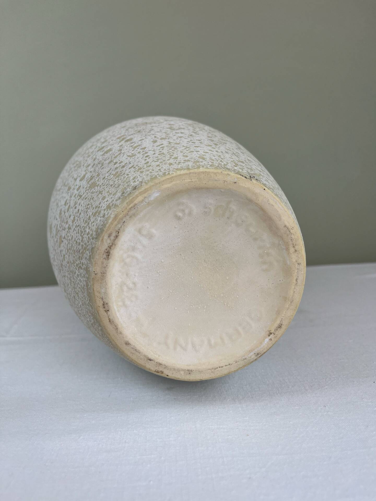 Cream speckled glazed vase with a gold rim, 1970s.