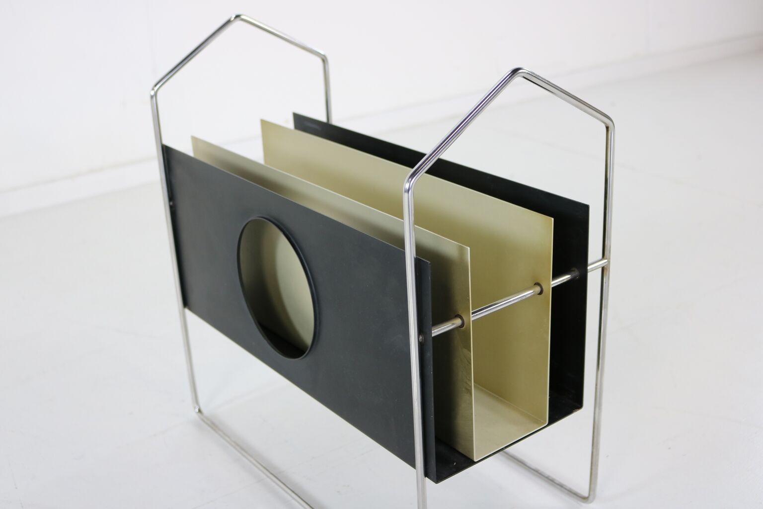 All metal magazine rack with sliding divider