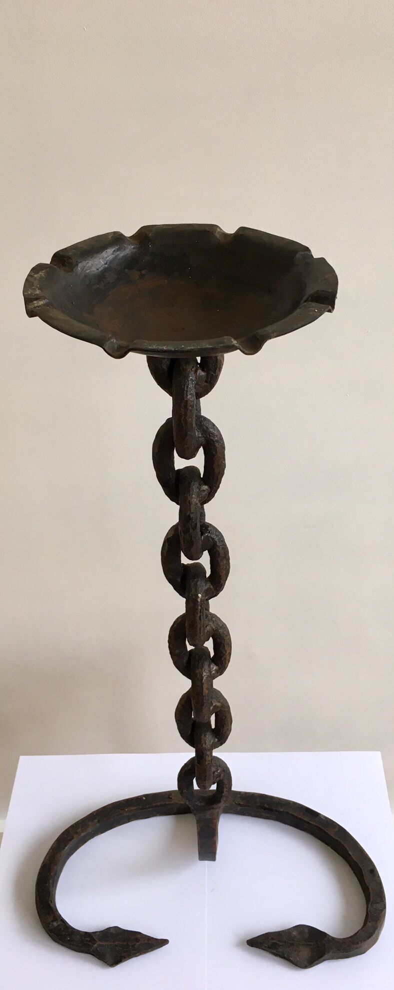 Wrought iron ashtray on its chain and anchor foot