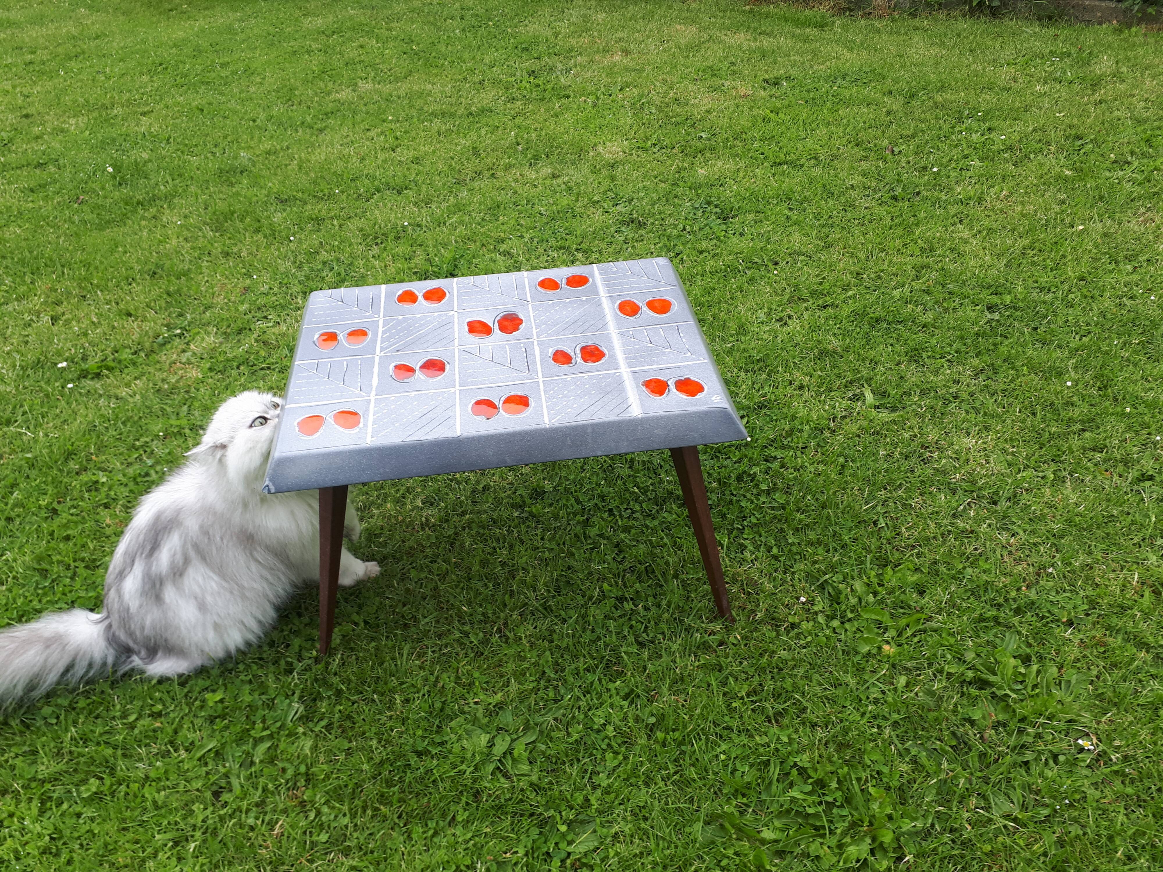 Small 1960s enamelled table, spindle legs, signed jd.