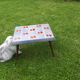 Small 1960s enamelled table, spindle legs, signed jd.