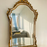 Large golden mirror parecloses