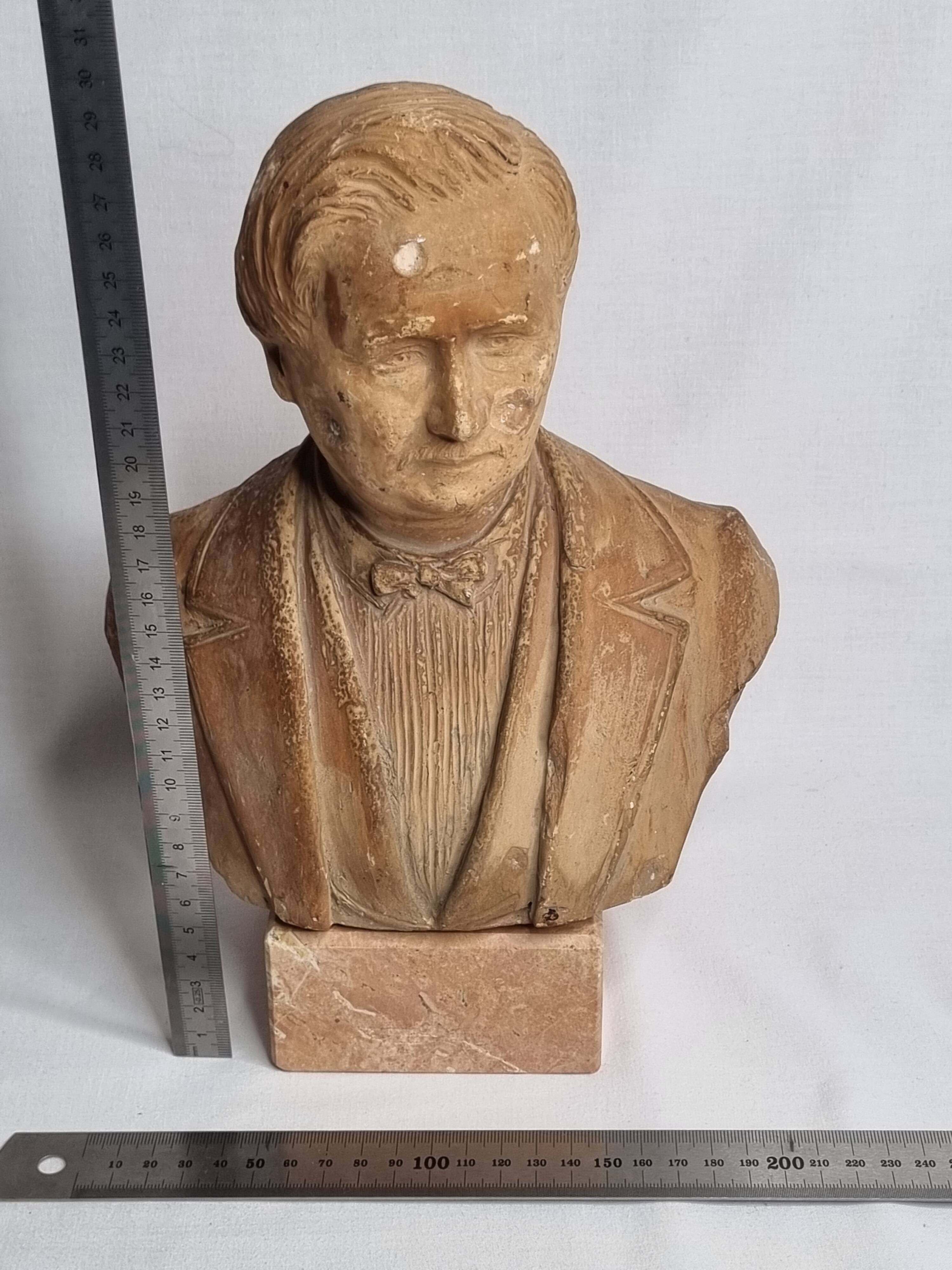 Bust of a notable in terracotta, 29 cm, signed Pasquet, 1870, on a base.