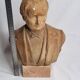 Bust of a notable in terracotta, 29 cm, signed Pasquet, 1870, on a base.