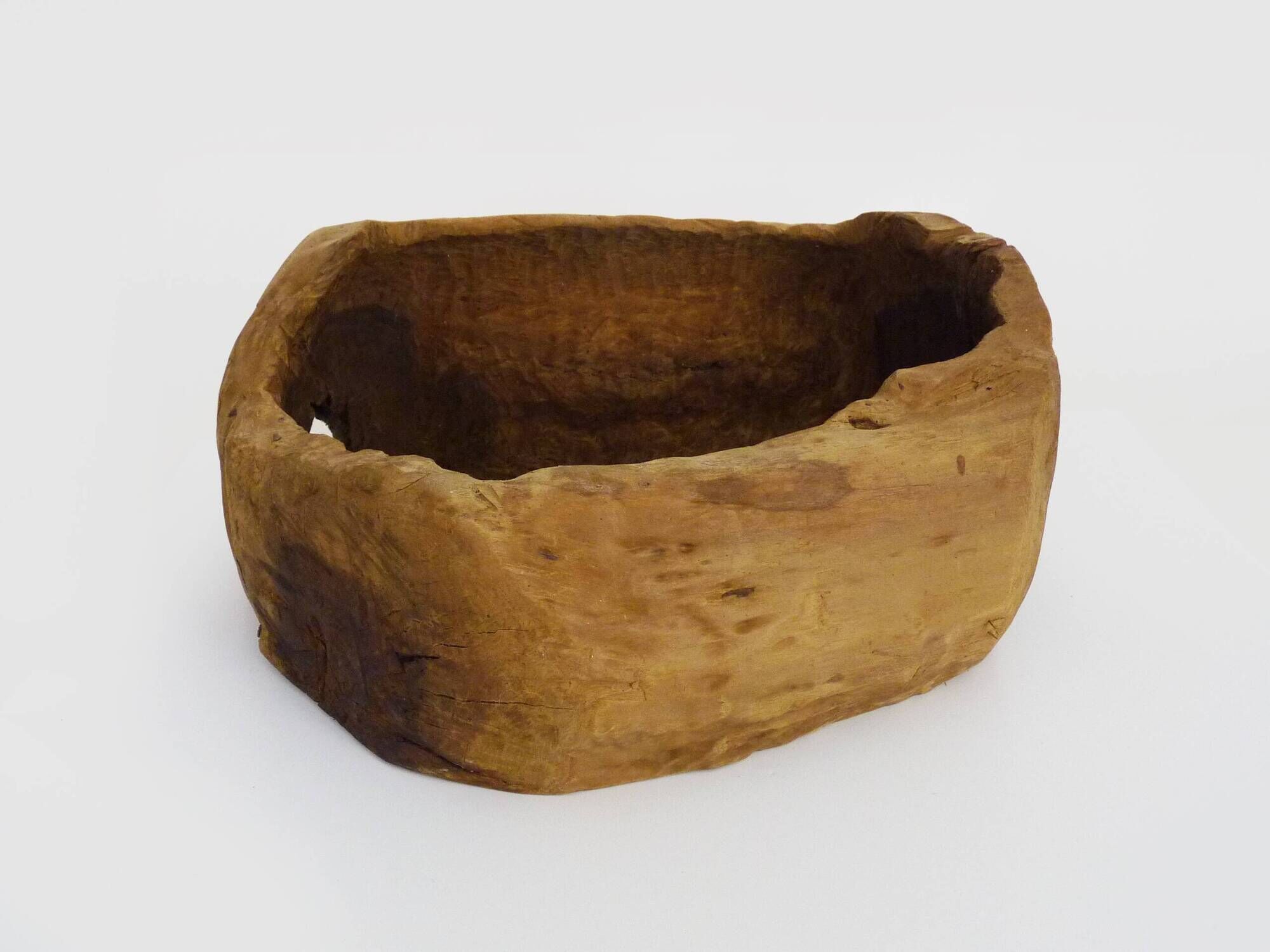 Old wooden farm water trough. Centerpiece, floral decoration. 1950