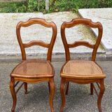 2 Louis Philippe caned chairs from the 19th century in solid wood.