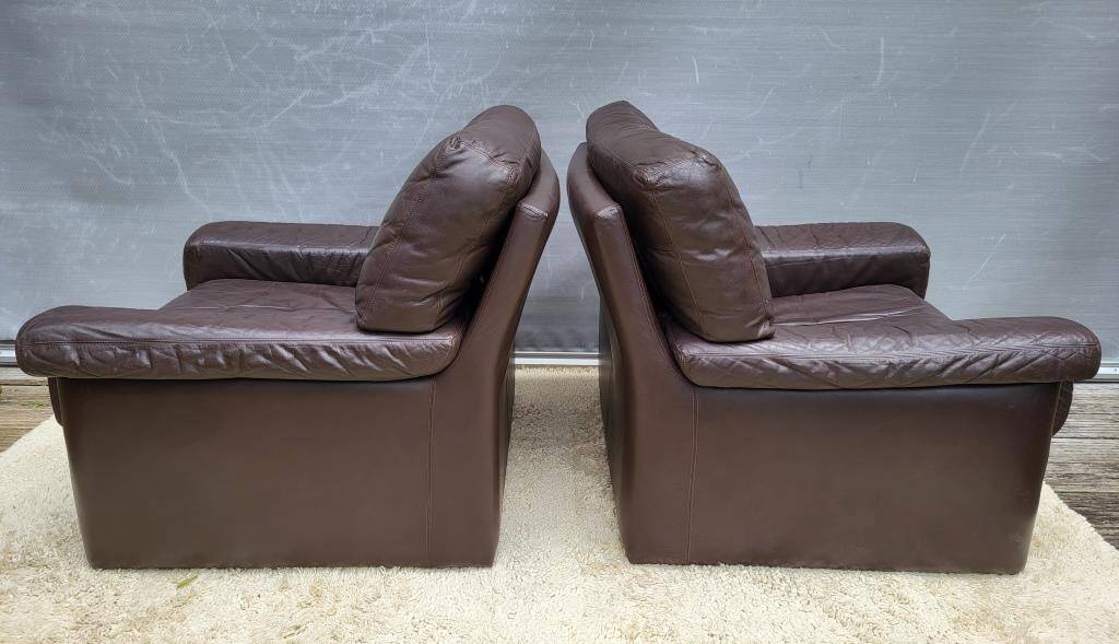 Pair of chocolate leather lounge chairs