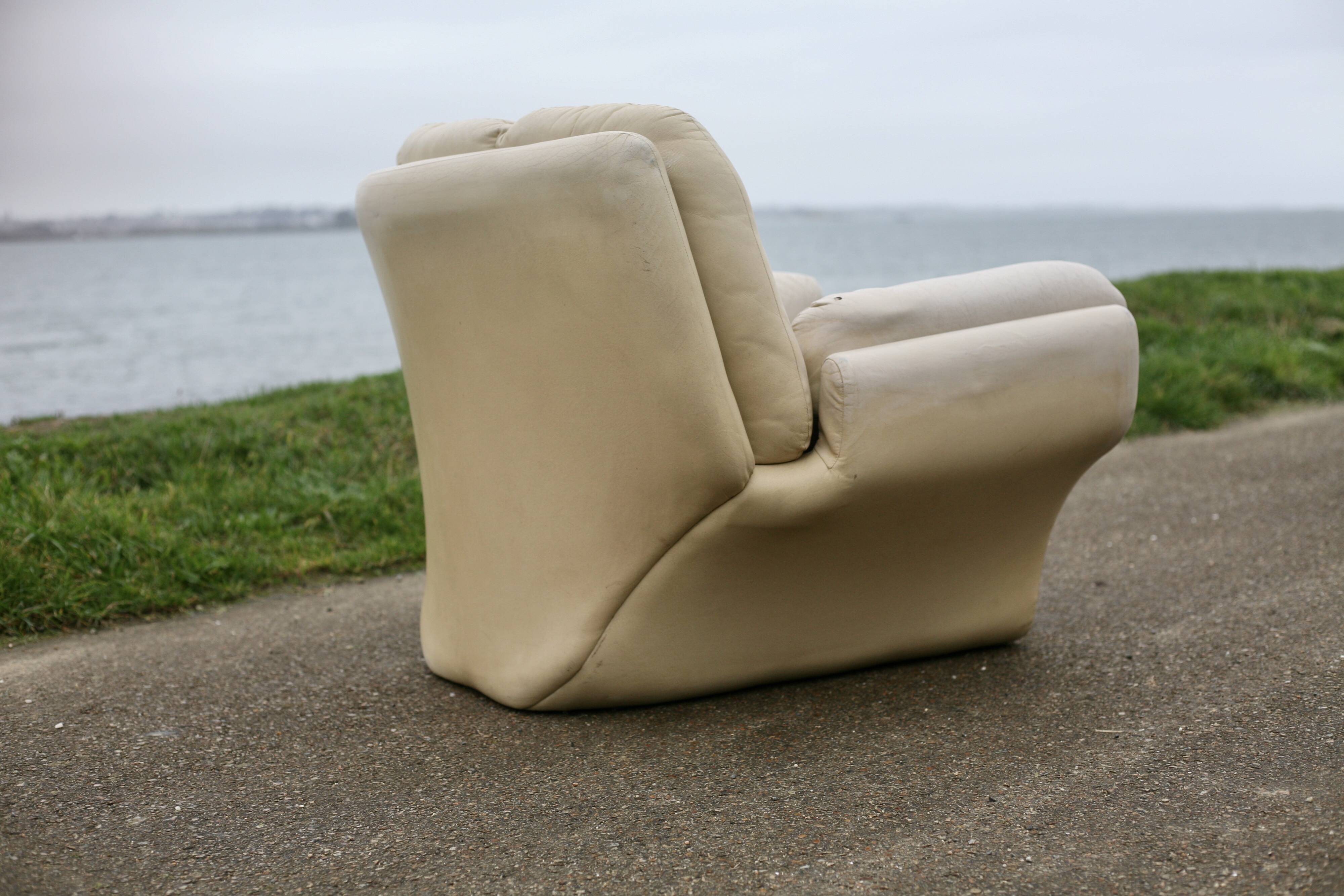 Pair of leather “space age” armchairs. Cream colour". Circa 1970.