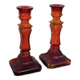 Pair of amber glass candlesticks