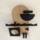 Geometric wooden painting - relief collage of natural and black wood