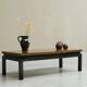 Modernist coffee table with a patinated gold top, 120x52.5x36 cm, mid-20th century.