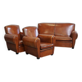 Very beautiful complete set consisting of a sheepskin leather sofa and two armchairs in cognac color