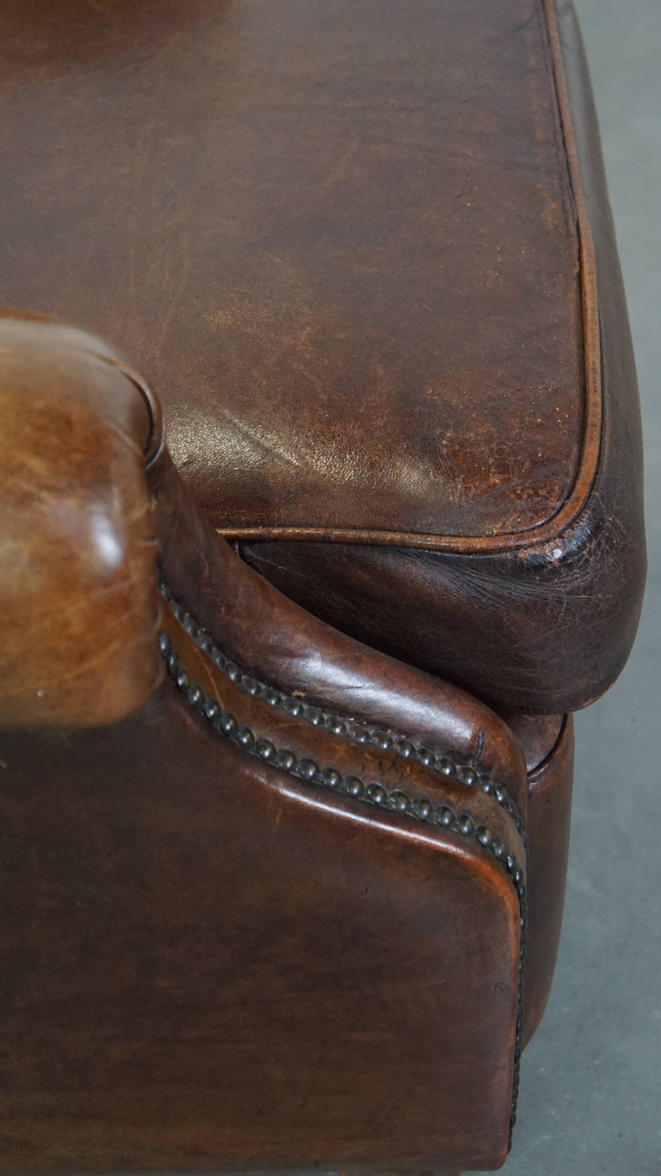 Sheep leather armchair on wheels