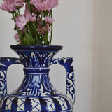 White hand-painted ceramic vase with blue patterns