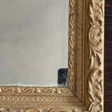 Old small baroque mirror with mercury tin